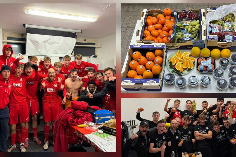 Gruppenfoto von jungen Fu&szlig;ballspielern in roten Trikots zusammen mit einer Auswahl an frischem Obst und Getr&auml;nken.