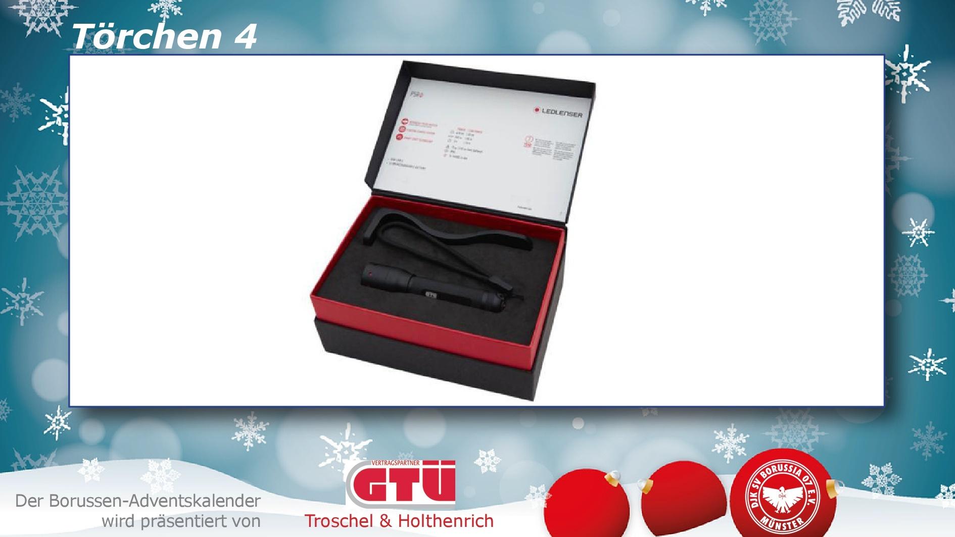 Geschenkbox mit schwarzem Taschenlampen-Set, bestehend aus einer Lampe und Zubehör auf rotem Innenfutter.