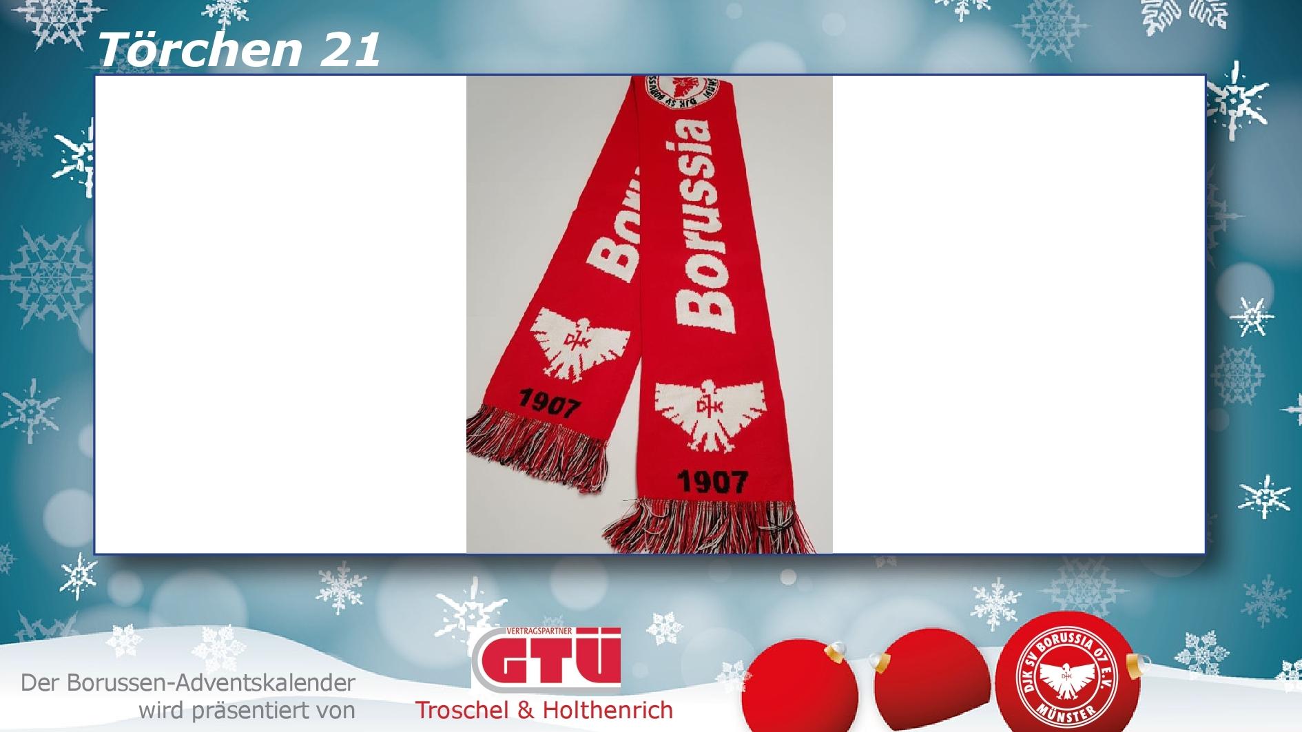 Rote Fanschals mit dem Aufdruck "Borussia" und einem Adler auf einer blauen, weihnachtlich dekorierten Hintergrund.